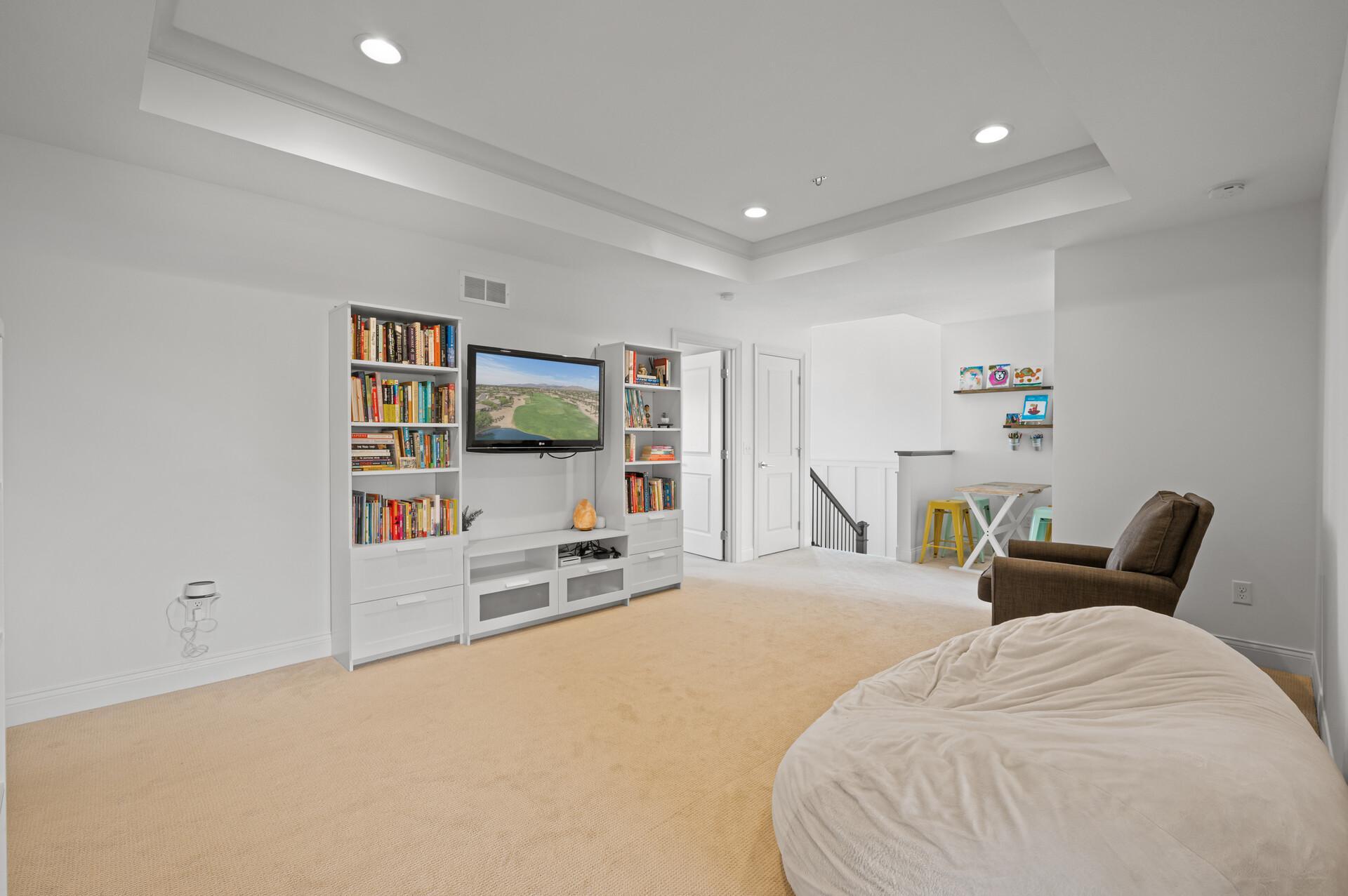 Versatile loft area that can serve as a cozy reading nook, study space, or additional family gathering spot.
