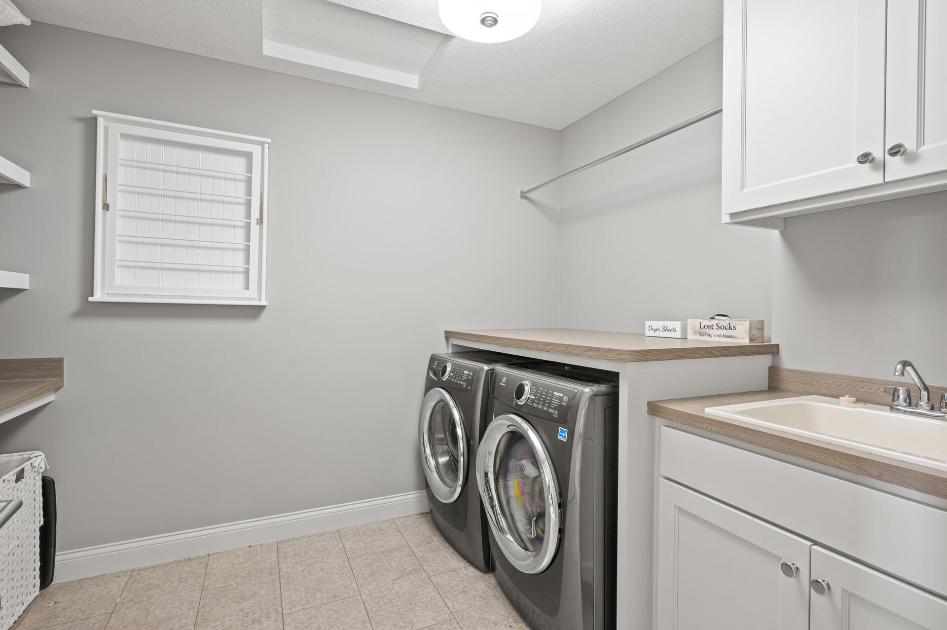 Convenient upper-level laundry room, adding to the home's practicality.