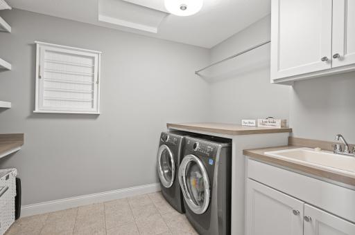 Convenient upper-level laundry room, adding to the home's practicality.