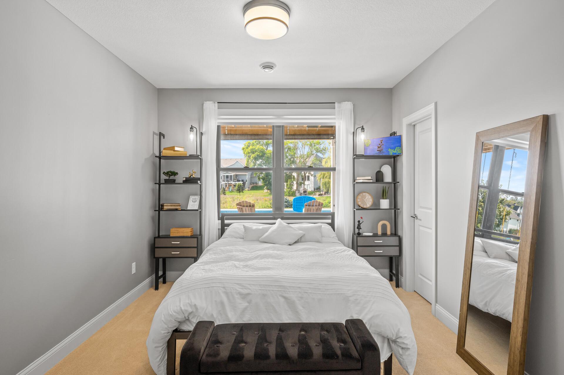 Additional bedroom on the lower level, ensuring comfort and privacy for guests or family members.