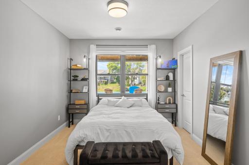 Additional bedroom on the lower level, ensuring comfort and privacy for guests or family members.