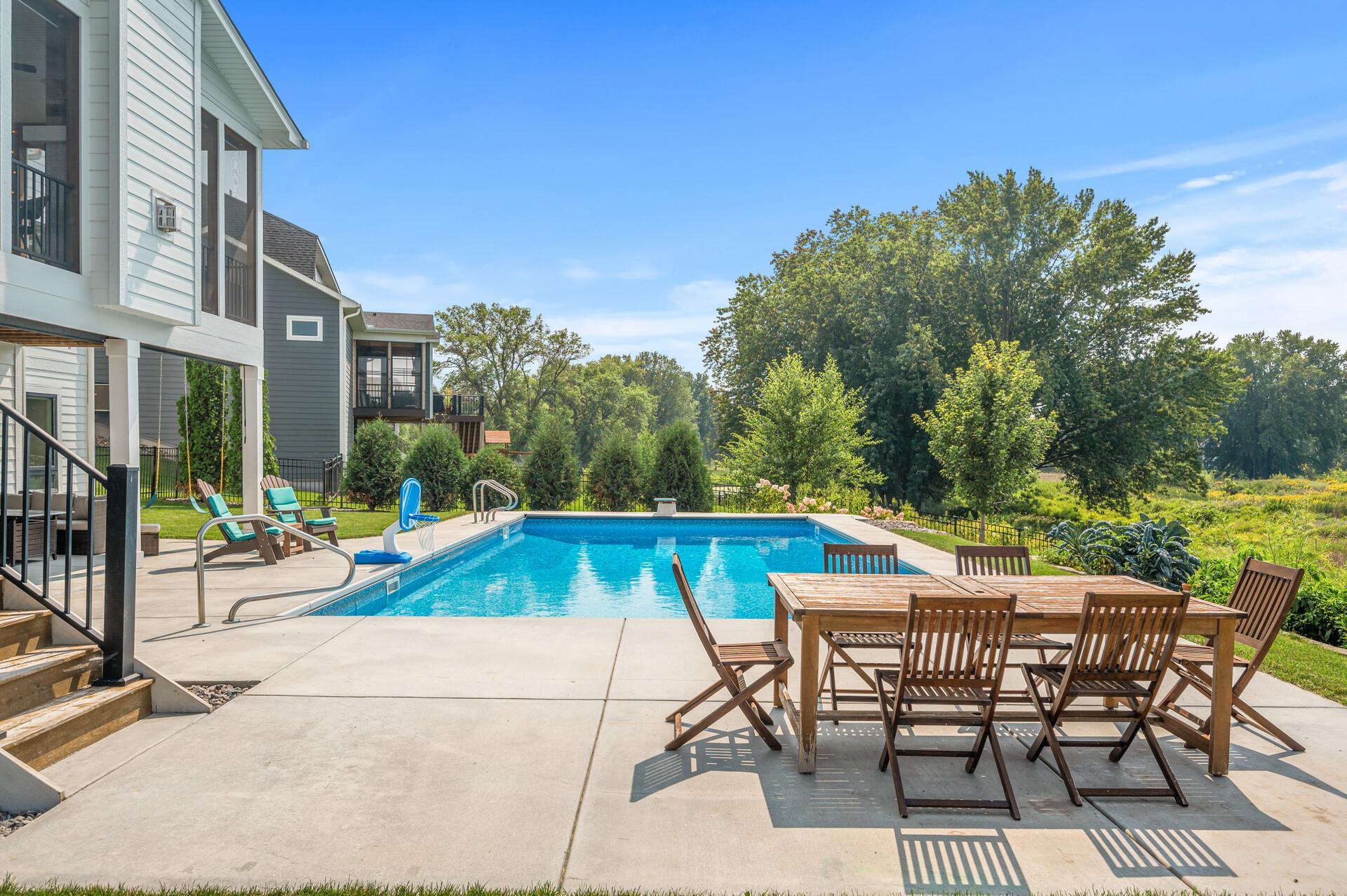 Several outdoor spaces to take in the scenic views. Covered patio area providing shade and a perfect spot for outdoor dining or lounging.