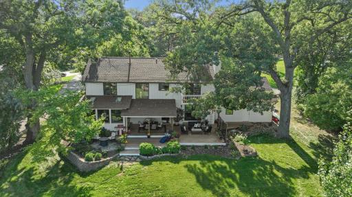Refreshed landscaping and brand new boulder rip rap at the shore (2023). The property features an attached 3+ car garage, providing both shelter for your vehicles and ample storage space for your lake toys.