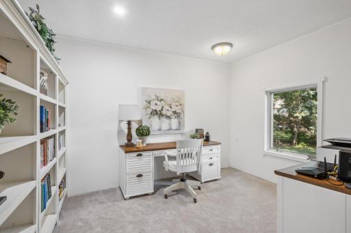 On the main level, you'll find a convenient office space and laundry facilities for added practicality.