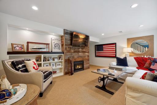 Lower level living room with gas burning fireplace.