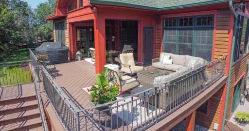Maintenance free deck with motorized screen walls