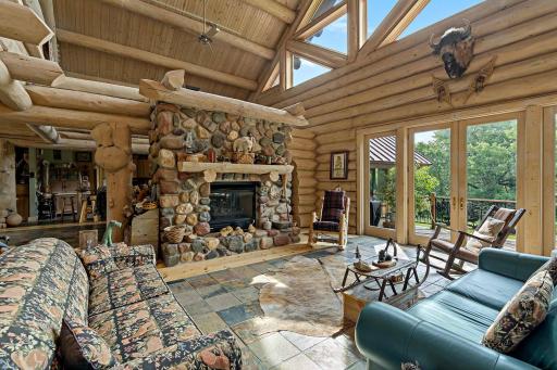 Custom two sided field stone catalytic gas fireplace
