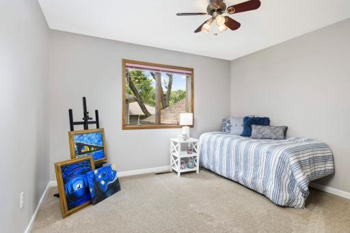 The second bedroom is located on the upper level and can easily access the bathroom through a private door.