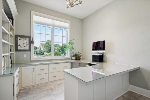 Photo for 16655 32nd Avenue N, Plymouth, MN 55447 - Listing #6430181 A built-in desk, file drawers, and shelving provide efficient workspace and there is a lockable closet for sensitive storage in the main floor office.