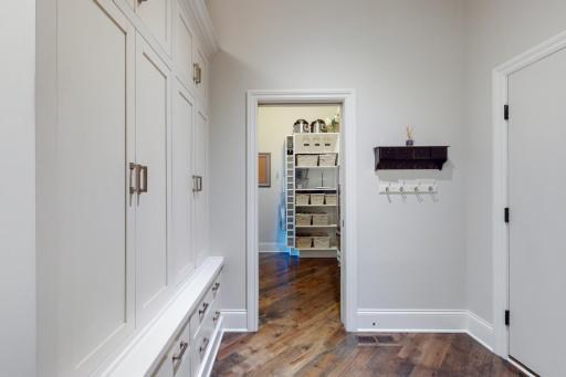 Photo for 16655 32nd Avenue N, Plymouth, MN 55447 - Listing #6430181 Mud room with floor to ceiling shelving and cabinet for storage is great space and the adjacent cabinet/cubby storage is a nice accent providing the ultimate in flexible storage.
