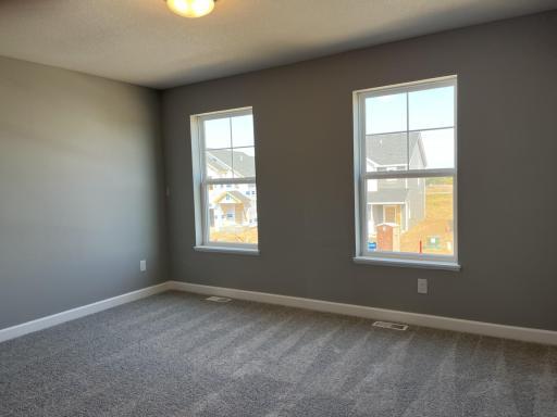 Spacious owner's suite with an abundance of natural light.