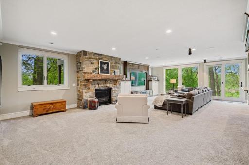 Stone faced, gas fireplace with Dolby Atmos sound system.