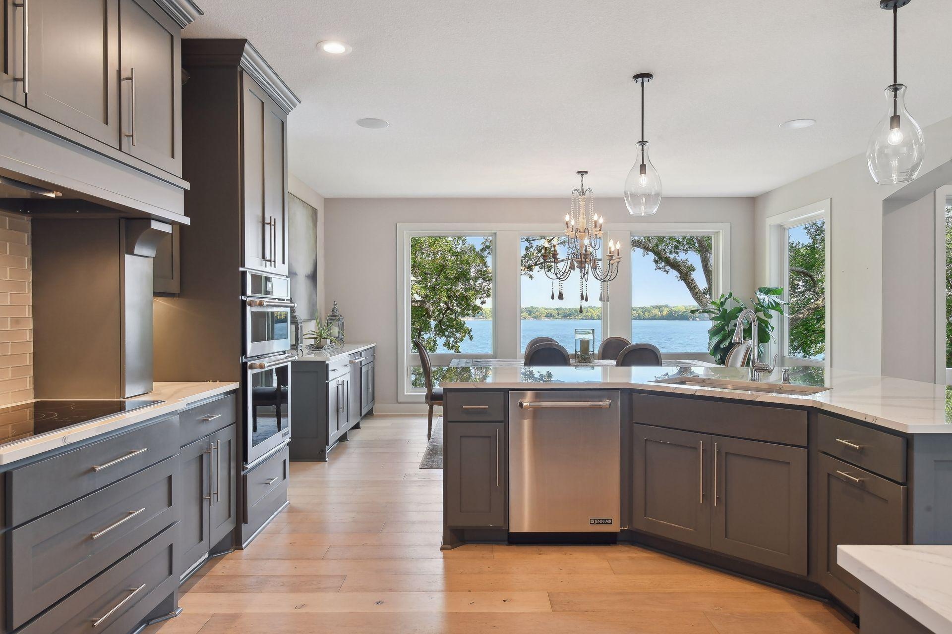 Gorgeous wide-plank Du Chateau Trestle European white oak engineered hardwood floors flow throughout the main level.