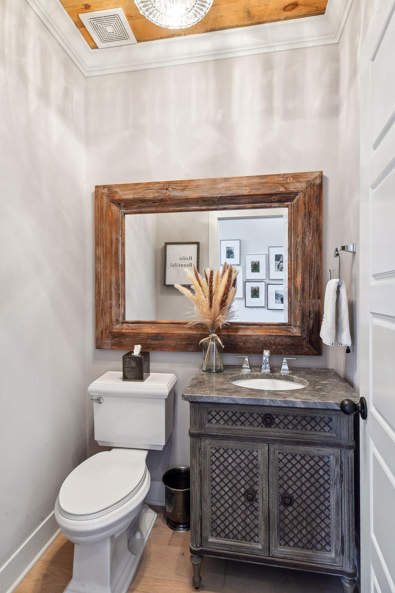 Enameled crown molding and designer finishes accentuate the Powder Room.
