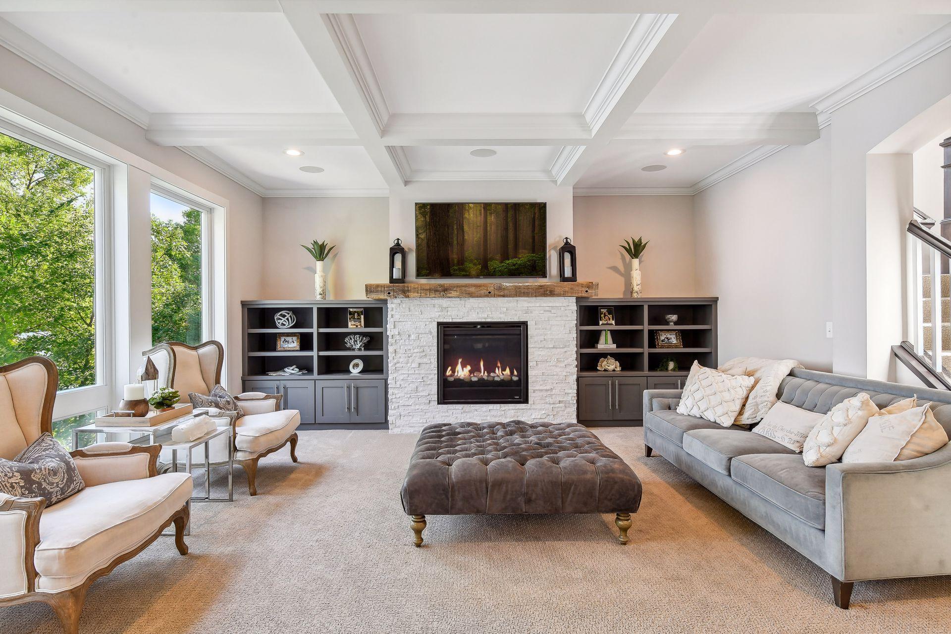 The Great Room features a cozy gas fireplace flanked by custom built-ins and a reclaimed railroad tie mantle.