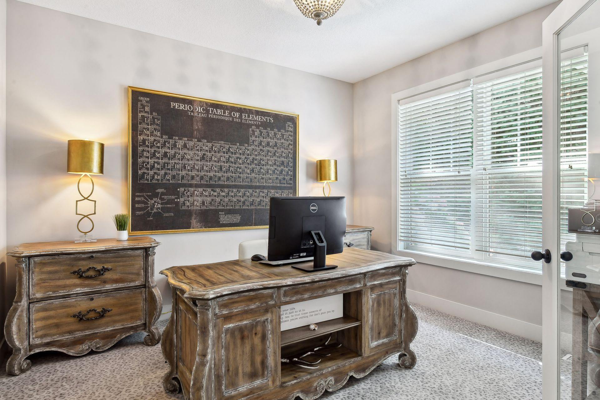 Nestled behind a set of French doors is the main level Home Office. A tranquil space that is excellent for working from home.