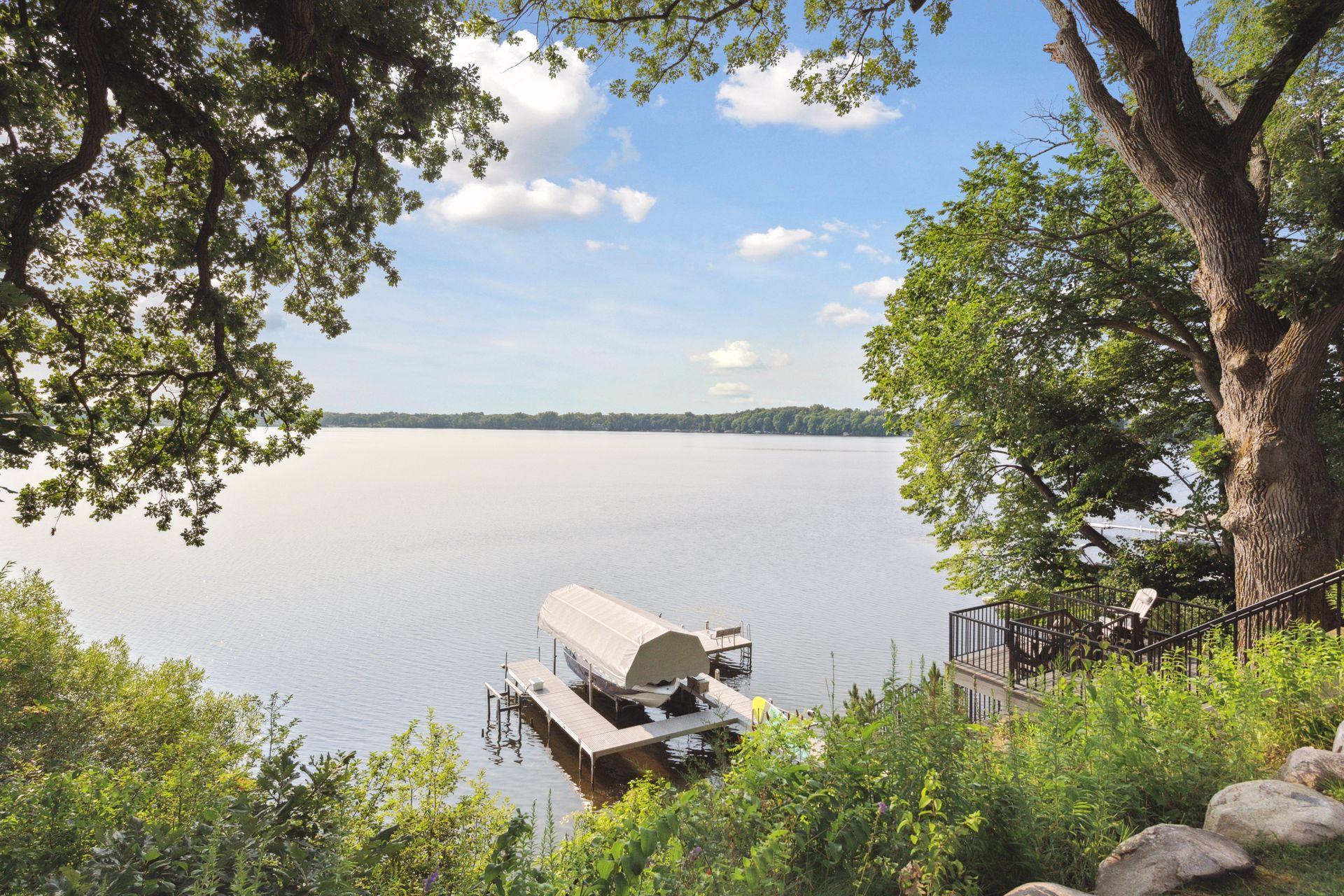 Enjoy over 150-feet of east-facing shoreline on this fully recreational lake.