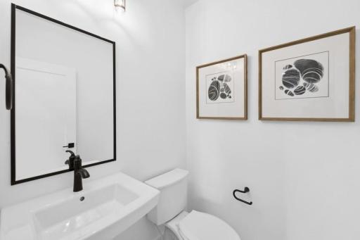 Lower level half bath is easily accessible to the exercise room and entertaining space!