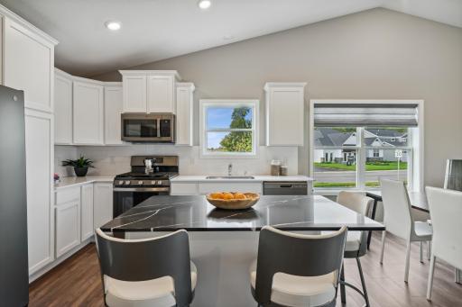 You'll appreciate having extra seating at the kitchen island! *Photos are of a model home; actual features and colors will vary.