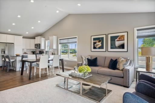 High celings create a dramatic impact in the main level, and there are tons of windows bringing in natural light! *Photos are of a model home; actual features and colors will vary.