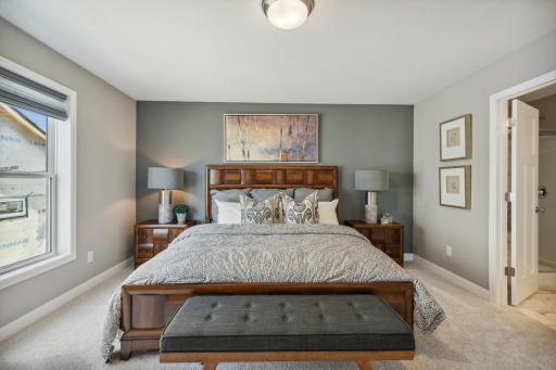 The owner's suite is one of three upper level bedrooms. *Photos are of a model home; actual features and colors will vary.