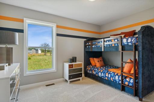 One of three upper level bedrooms. *Photos are of a model home; actual features and colors will vary.