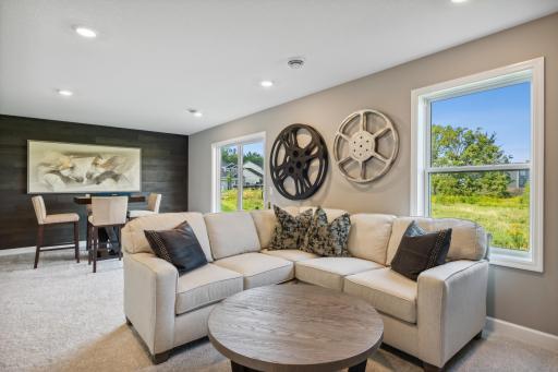 This photo is an example of how a homeowner could finish the basement after closing. This area will not be completed in the actual home; however, other homesites are available to allow a customer to have the basement finished by the builder.