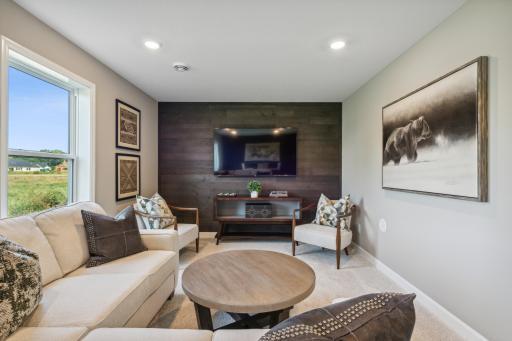 This photo is an example of how a homeowner could finish the basement after closing. This area will not be completed in the actual home; however, other homesites are available to allow a customer to have the basement finished by the builder.
