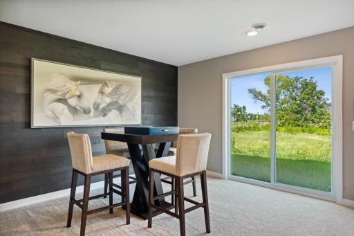 This photo is an example of how a homeowner could finish the basement after closing. This area will not be completed in the actual home; however, other homesites are available to allow a customer to have the basement finished by the builder.