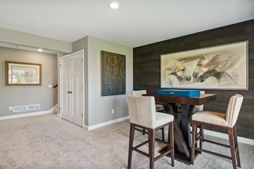 This photo is an example of how a homeowner could finish the basement after closing. This area will not be completed in the actual home; however, other homesites are available to allow a customer to have the basement finished by the builder.