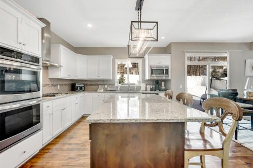 Custom White cabinetry HUGE center island perfect for Entertaining and additional Seating