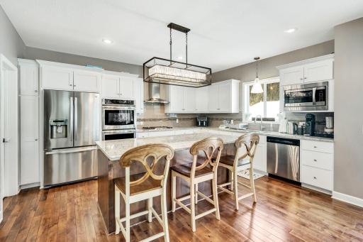 Gourmet kitchen double oven all stainless aplliances and stunning backsplash