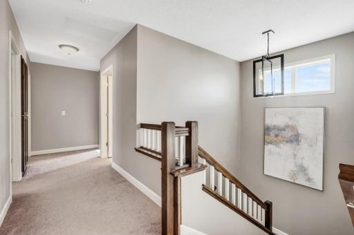 Wide hallway charming landing perfectly placed window for natural light
