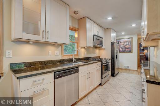 Updated cabinets, granite counters, undercabinet lighting, LED can lighting