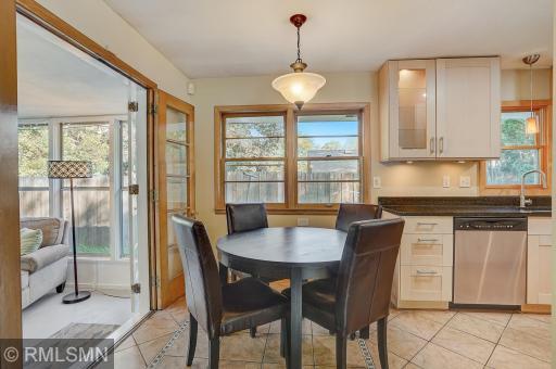 Spacious dining area between the kitchen and 3 season porch
