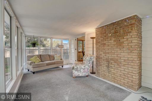 3 full walls of windows - and the 4th wall hosts two sets of french doors