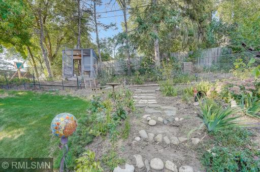 Take the steps up to the garden. Chicken coop can stay or go, just let us know!