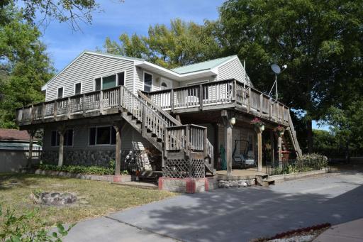 1960s built lake home raised and remodeled approximately 20 years ago has vinyl siding and a steel roof. Low maintenance means more time to enjoy Lake Ann!