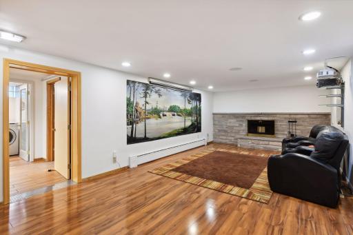 The fireplace and stunning floors add a touch of classic beauty, and the built-in speaker systems promise an immersive audio experience.