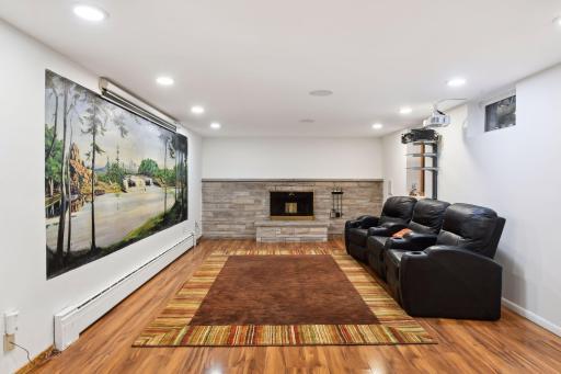 Unwind in style in this elegant family room, featuring a wood-burning fireplace that exudes warmth and comfort.