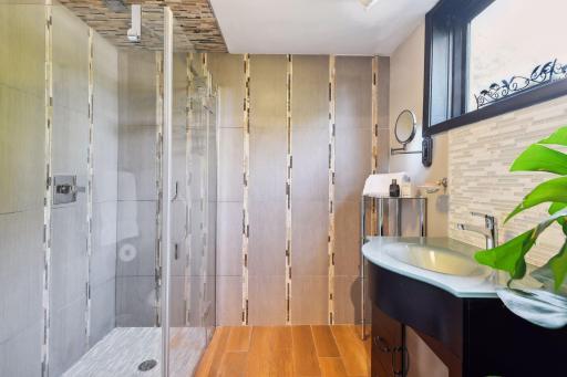 Convenience meets style in the lower level's full bathroom. Immerse yourself in luxury, making this space an ideal haven for guests or family members. Every detail adds to the charm and comfort.