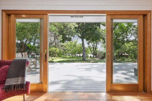 Expansive living room seamlessly connects to the deck through sliding patio door access, making indoor-outdoor living a breeze!