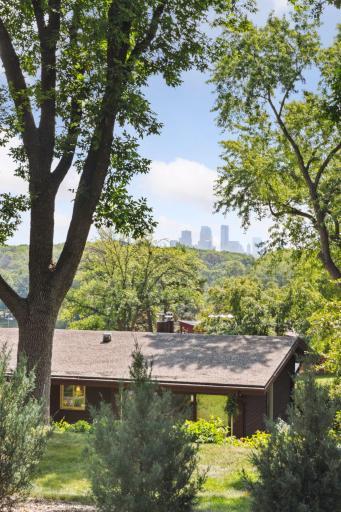 Indulge in the awe-inspiring panoramic views of the iconic Downtown Minneapolis Skyline & the charming neighborhood below.