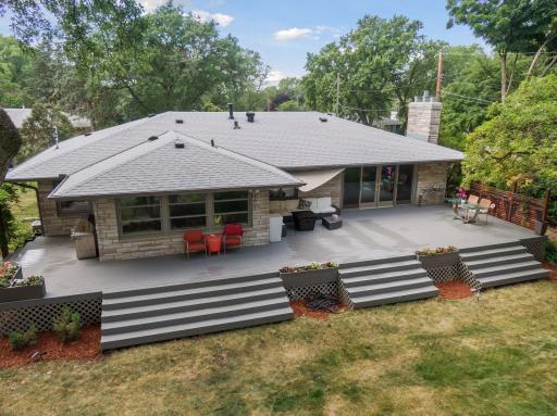 Enjoy the great outdoors in style on the Trex deck, featuring multiple seating areas for delightful gatherings.