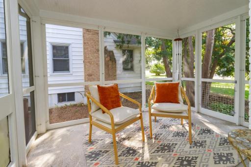 Screen porch has access to front and back yards