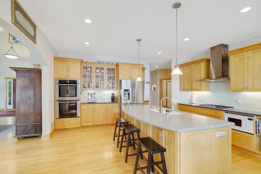 Abundance of cabinet and countertop space including Large Corian Top Island