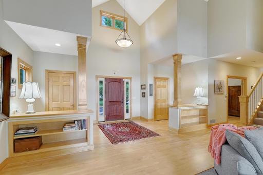 Towering Foyer with dual closets and built-in shelving