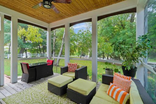 Sure to be a favorite spot, an adorable screened porch overlooking the lake and yard is right behind the fireplace