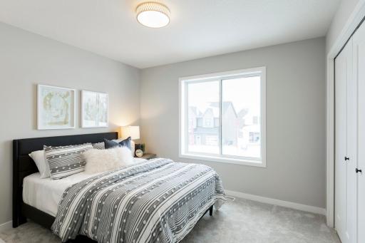 Bedroom #2 on the upper level is a great sized room with west facing windows to enjoy the Victoria sunsets!