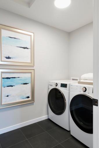The upper level laundry room is just steps away from the bedrooms for your convenience! Enjoy the luxury vinyl flooring and LG electric washer and dryer.
